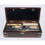 A large Victorian rosewood draughtsman's box, hinged cover enclosing a fitted interior with a
