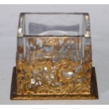 A late 19th century gilt metal and clear glass square table vase, 11.5cm wide, foundry mark AF, c.