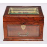 A Victorian walnut dressing table cabinet, glazed hinged cover and fall front with bevelled panes