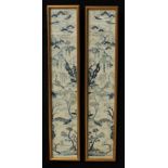 A pair of Chinese silk sleeve panels, typically embroidered with monumental landscapes, 52cm x