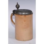 An 18th century pewter mounted English stoneware quart tankard, hinged cover with orb thumbpiece,