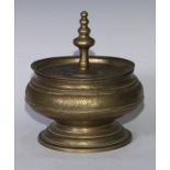 A Chinese bronze bowl and cover, chased with lotus and trellis, spire finial, domed foot, 24cm diam,