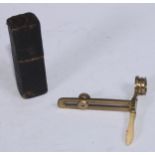 A 19th century lacquered brass pocket field microscope, sliding adjustment, turned handle, 8.5cm