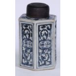 A Chinese porcelain hexagonal tea caddy, moulded and painted in tones of underglaze blue with leaves