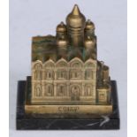 A Russian desk model, cast as a cathedral, rectangular marble base, 6.5cm long