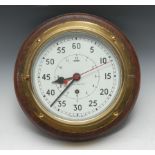 A military lacquered brass bulkhead marine timepiece, the 18.5cm clock dial with broad arrow mark