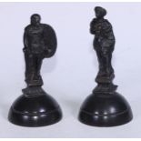 A pair of 19th century Grand Tour dark patinated metal figures, cast as a Roman senator and a