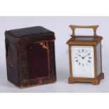 A lacquered brass carriage clock, Cowell, Douglas I of Man, leather carry case with key