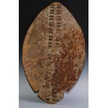 Tribal Art - a large Zulu cow hide shield, of typical form with two rows of geometric slats from