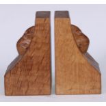 Mouseman of Kilburn - a pair of oak book ends, adzed overall, carved mouse signatures, 15.5cm high