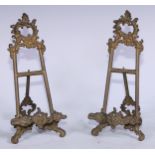 A pair of Rococo Revival brass table top easels, 23.5cm high