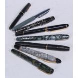 Pens - a Conway Stewart fountain pen, 14ct gold nib, 13cm long; another, Parker Slimfold; others,