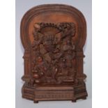 An Indian sandalwood votive shrine carving, arched back, 23cm high, 16cm wide, c.1900