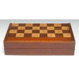 A 19th century mahogany and parquetry games box, inlaid for chess, the interior laid out for