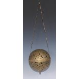 A large 19th century Indian/Middle Eastern rolling lamp or incense ball, pierced and engraved with