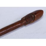 Tribal Art - an African prestige or status staff, the pommel carved with a face beneath a headdress,