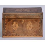 A George III mahogany and marquetry rectangular tea caddy, inlaid with oval batwing paterae,