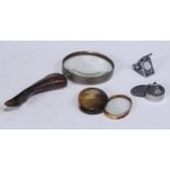 A 19th century cattle horn oval pocket lens, 6.5cm wide; a horn-hafted magnifying glass; etc (4)