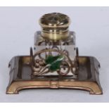 An Art Nouveau brass and enamel square inkstand, decorated with an ivy leaf, the glass well with