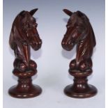 A pair of early 20th century mahogany oversize chess pieces, possibly advertising shop display