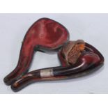 A late 19th century novelty pipe, the bowl as the head of an African woman, 16.5cm long, cased, c.