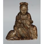 A Chinese soapstone figure, carved as guanyin, seated, serene, holding a lotus, a bird at her