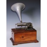 An early 20th century oak phonograph, the rectangular case with silvered swan neck handle. skired