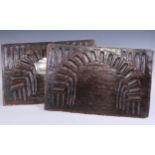 A pair of 17th century oak rectangular panels, carved with nulled arches, 36cm x 55cm, c.1680