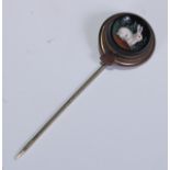 A 19th century novelty stick pin, the circular black glass terminal decorated with a rabbit, 7cm