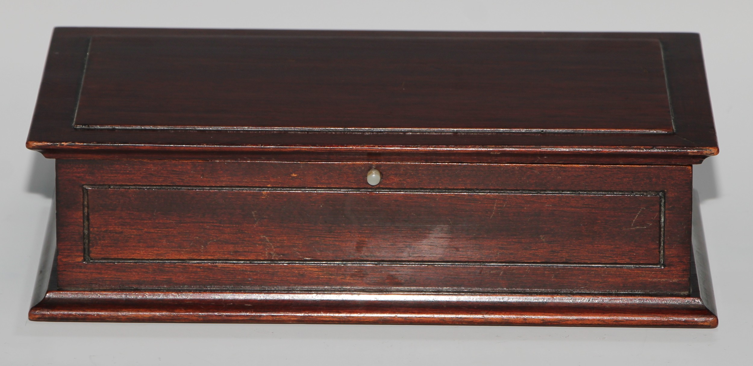 An early 20th century salvaged maritime timber rectangular playing card box, mahogany from the "