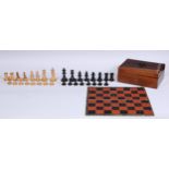 A boxwood and ebonised Staunton pattern chess set, the Kings 7cm high, associated rosewood box and