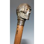 The Macabre - a novelty walking stick, the pommel as a skull, glass eyes, 94cm long overall