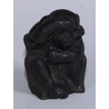 A Japanese novelty inkwell, cast as an inquisitive monkey looking through spectacles, 7cm high,