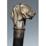 A novelty walking stick, the handle cast as the head of a dog, ebonised shaft, 88cm long