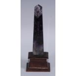 An amethyst quartz obelisk, mounted for the desk, 19cm high