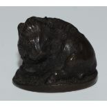 A Japanese bronze netsuke, cast as a wild boar, 3cm wide, signed