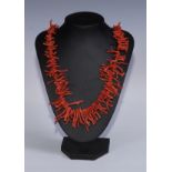 A coral necklace, 64cm long
