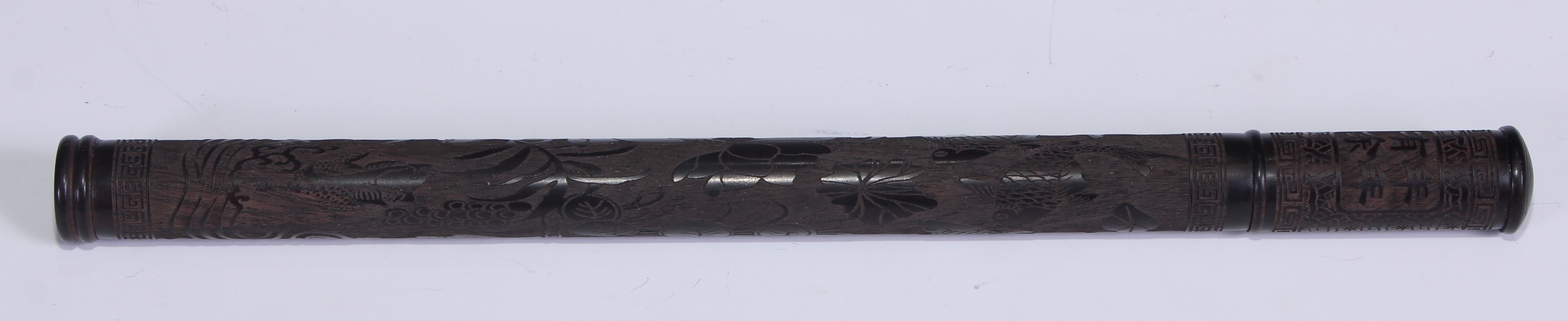 A Chinese hardwood incense holder, carved in shallow relief with goldfish and flowers, 24cm long