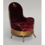 A French gilt metal novelty pocket watch stand, as an armchair, upholstered in damson plush and