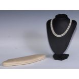 A double-row cultured pearl necklace, silver clasp, 40cm long, cased