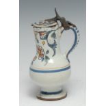 A German tin-glaze earthenware wine ewer, of small proportions, the long neck and shoulder painted