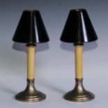 A pair of E.P.N.S student's lamps, each with conical shade and patent self-adjusting candle