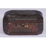 A Chinese export lacquer canted rectangular tea caddy, hinged cover enclosing a pair of paktong