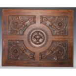 An 18th/19th century oak panel, carved in relief with a Neo-Classical urn to the centre of four