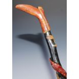 Folk Art - a polychrome painted walking stick, the handle carved as a boot, the shaft with a