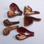 A Meerschaum tobacco pipe, the bowl modelled as the head of a lady of fashion, cased; others (4)