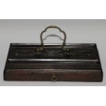 A George III mahogany partners' inkstand, with provision for three wells, shaped brass carrying