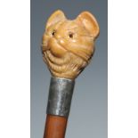 An early 20th century novelty walking stick, the vegetable ivory pommel carved as the head of a cat,