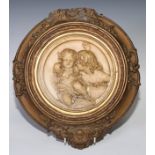 A 19th century relief plaque, designed by Wyon after Sir Thomas Lawrence, 19cm diam, giltwood and