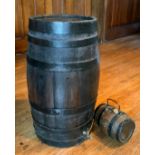 A coppered barrel, 68cm high; a brandy coopered barrel, with wire handle, 21cm high (2) ** We